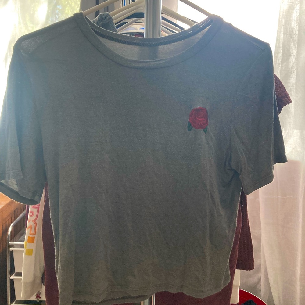 Soft green homegirl society tshirt. Has a red rose embroidery on the front.